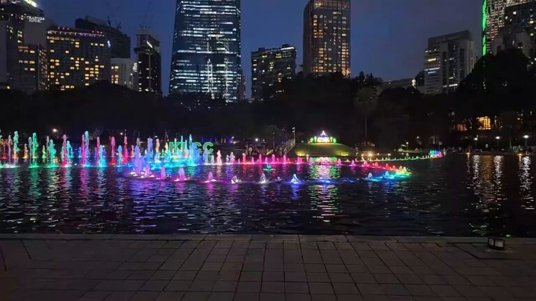 Lit-up fountain show on the lake at KLCC Park at night