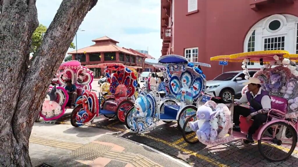 Hello Kitty and cartoon-themed trishaws lined up at Dutch Square