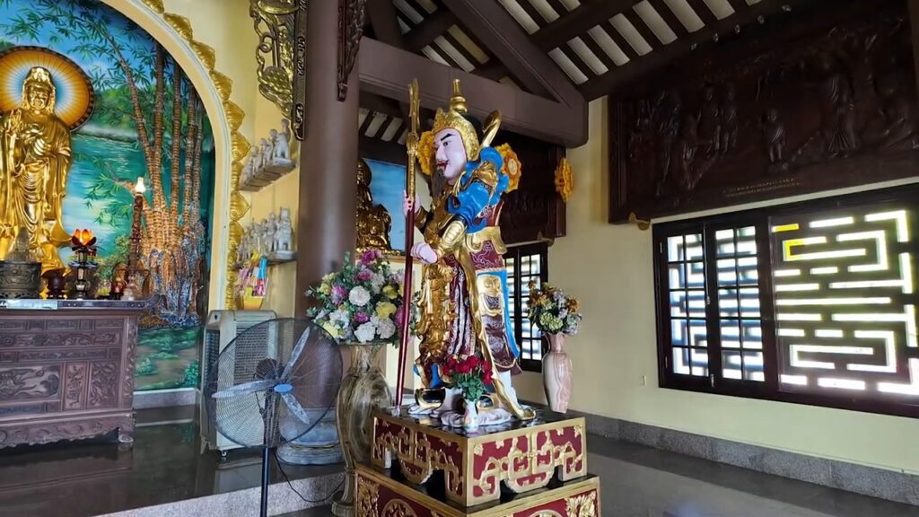Gilded statues inside the temple at Linh Ung Pagoda