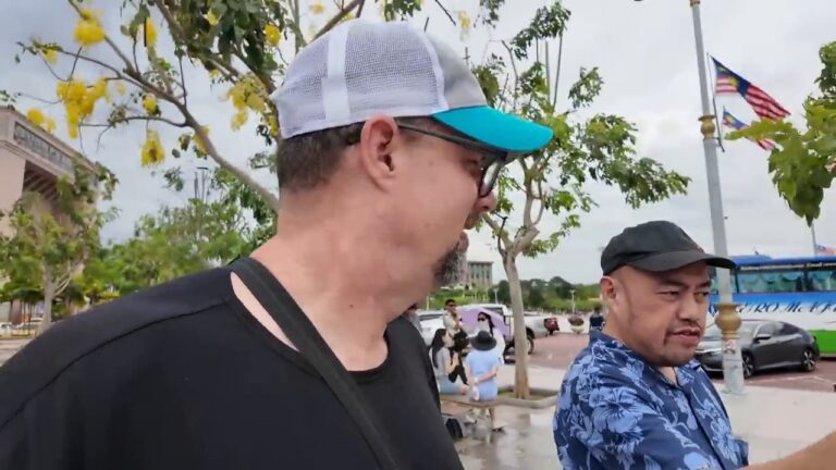 Bill with his friend Shum on a day out in Malaysia