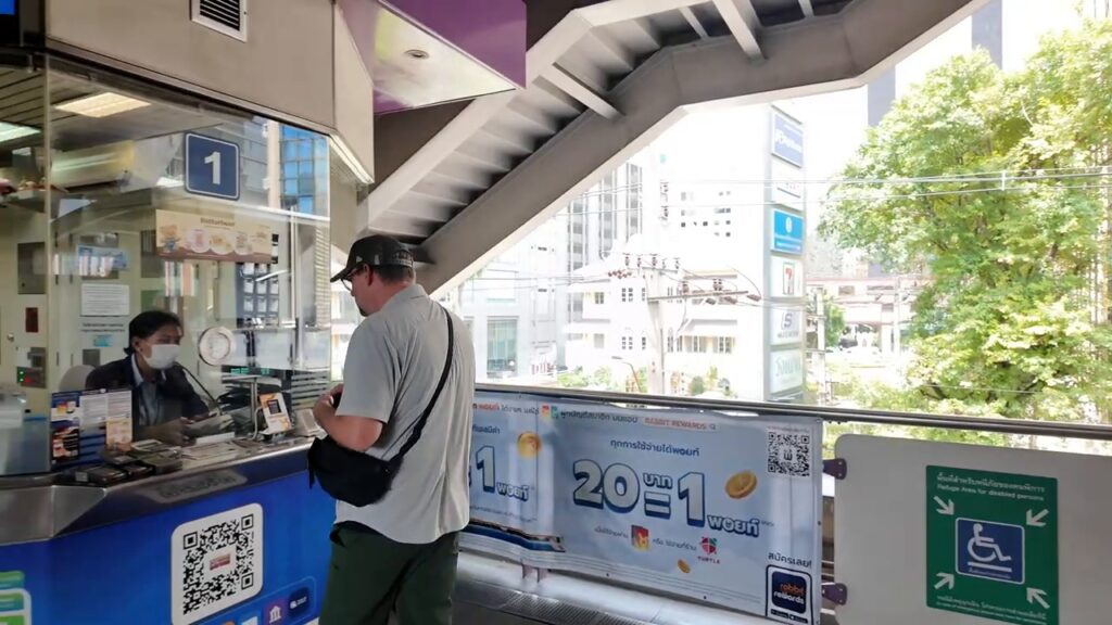 Buying a Rabbit Card at a BTS ticket office in Bangkok