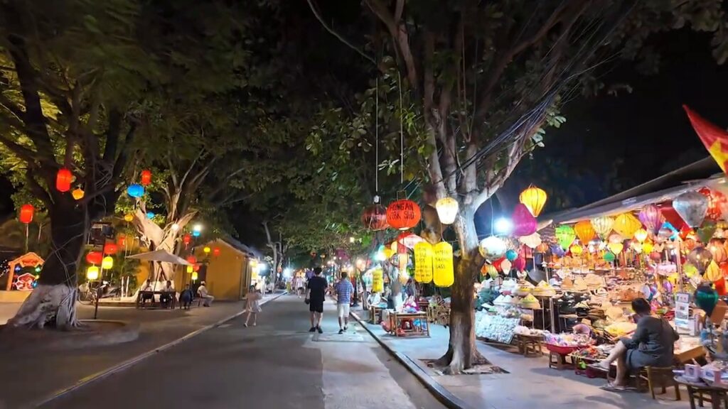 Lanterns and shops lining a street in Hoi An Ancient Town at night