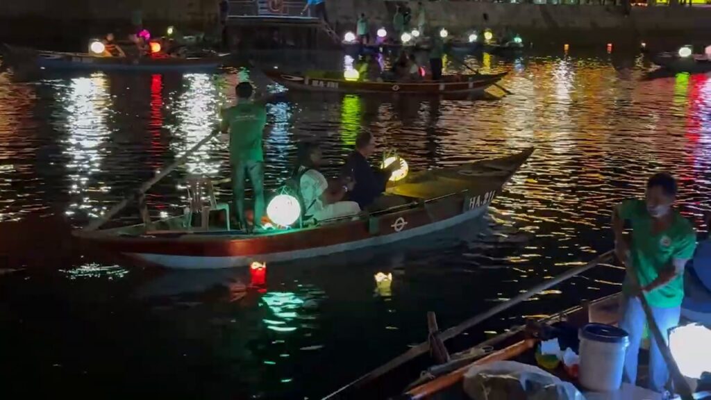 Small boats with lanterns on the river in Hoi An at night