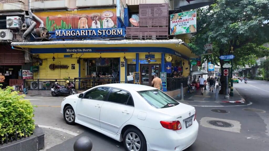 Corner bar and traffic on Sukhumvit near Nana