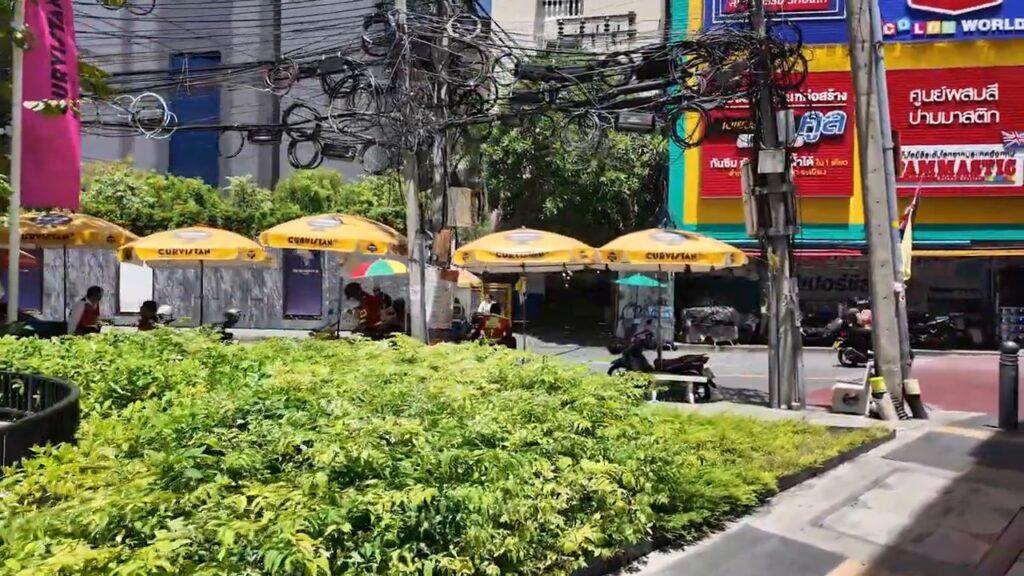 Yellow umbrellas over food stalls near Ekkamai