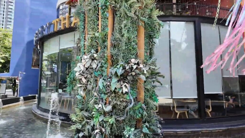Plant-covered café front on Sukhumvit Road