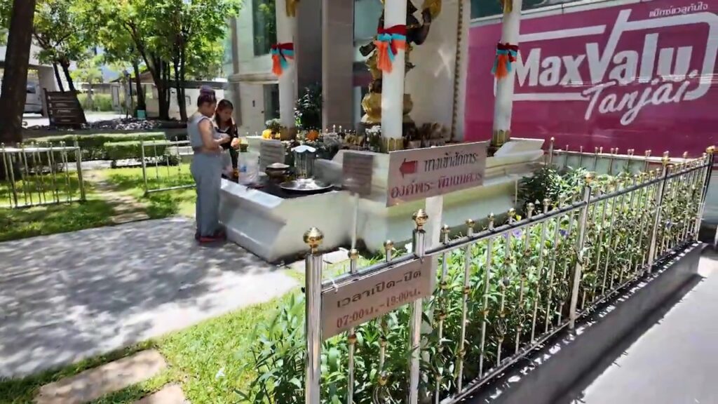Small spirit shrine on the sidewalk along Sukhumvit Road