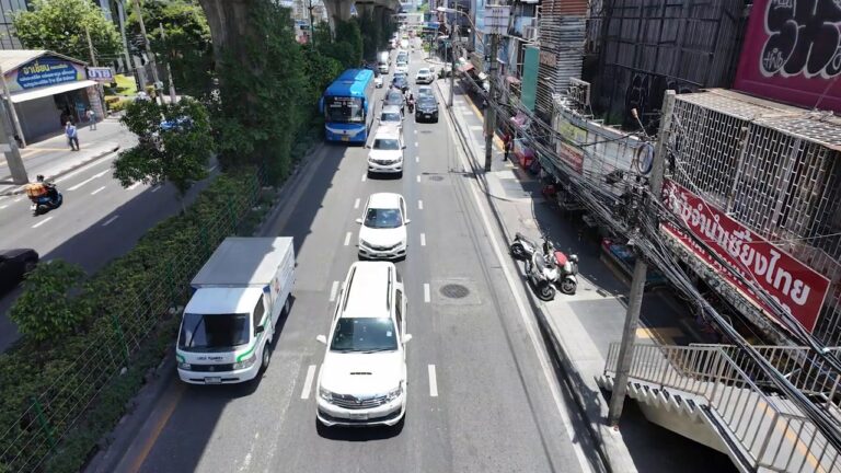 View down Sukhumvit Road traffic from an elevated walkway in Bangkok