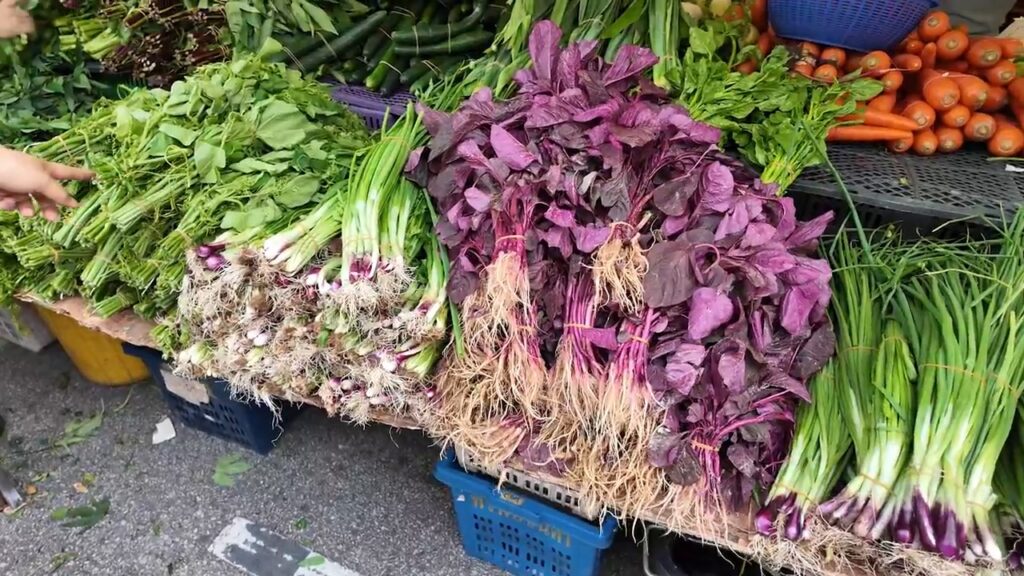 Red spinach and leafy greens at the Kepong pasar malam