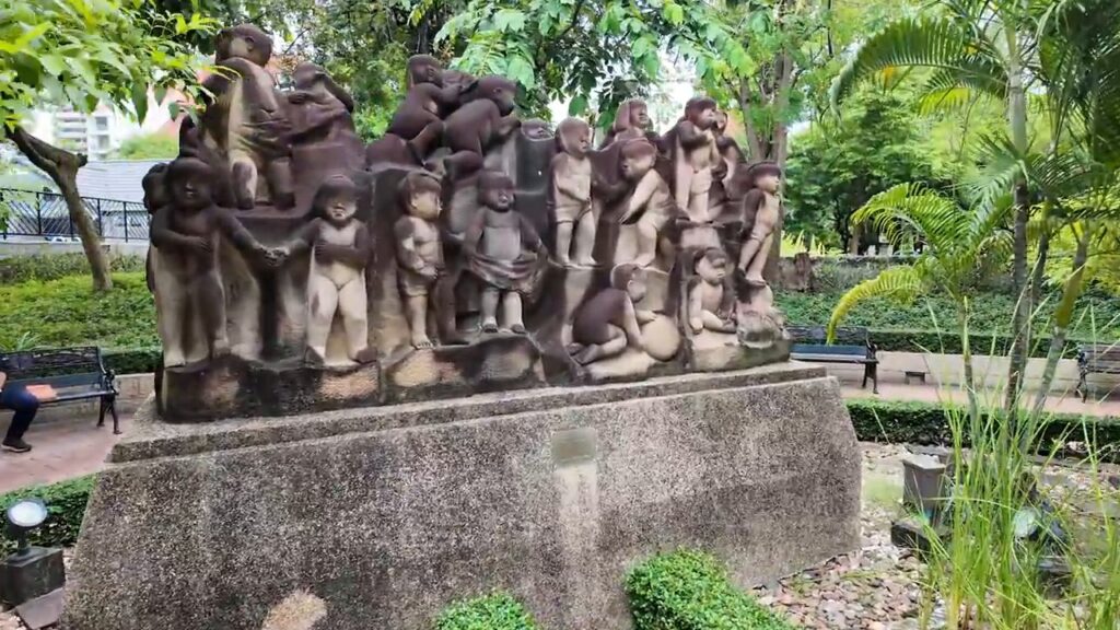 Sculpture of a group of figures in Benchasiri Park