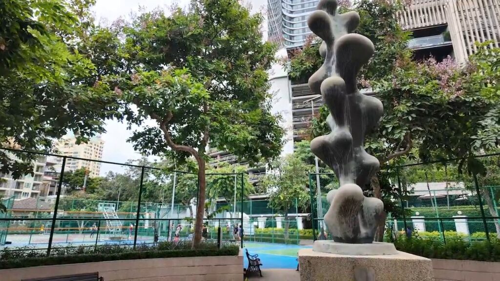 Modern sculpture among the trees at Benchasiri Park