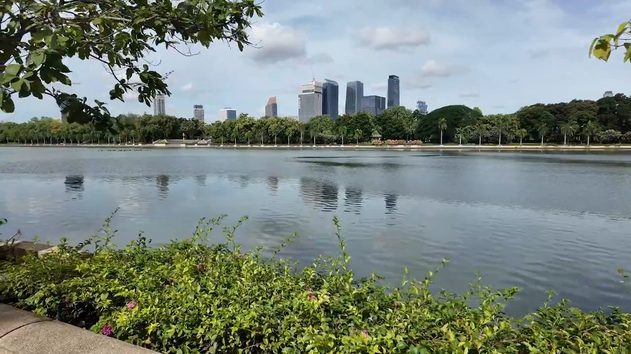 Benjakitti Park lake with the Bangkok skyline