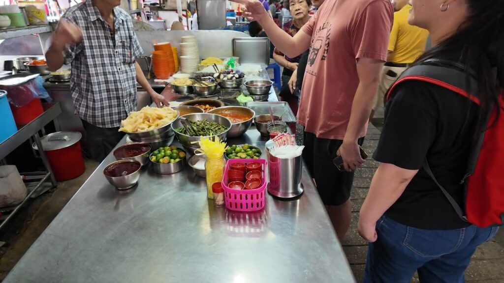 Local noodle stall at a morning market in Kuala Lumpur Chinatown