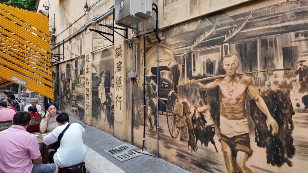 Large mural of old Kuala Lumpur street life in Chinatown