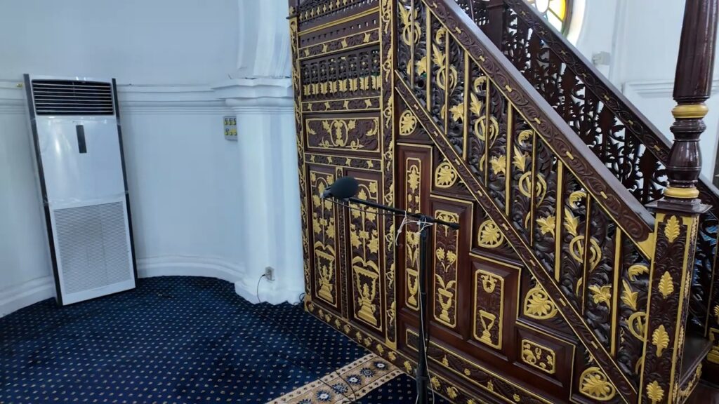Hand-carved ironwood minbar inside Masjid Panglima Kinta