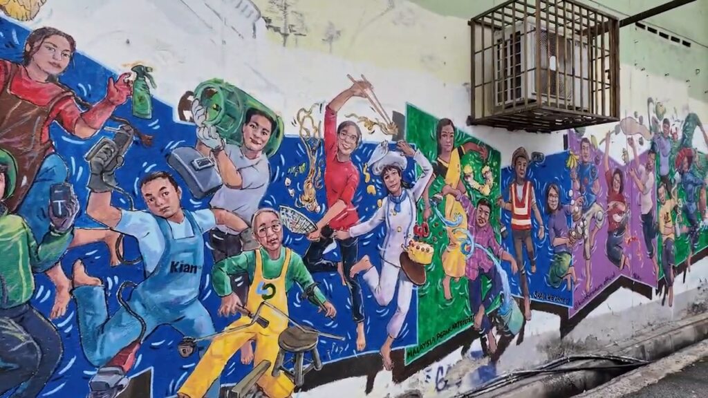 Colorful street mural of Malaysian life in Ipoh