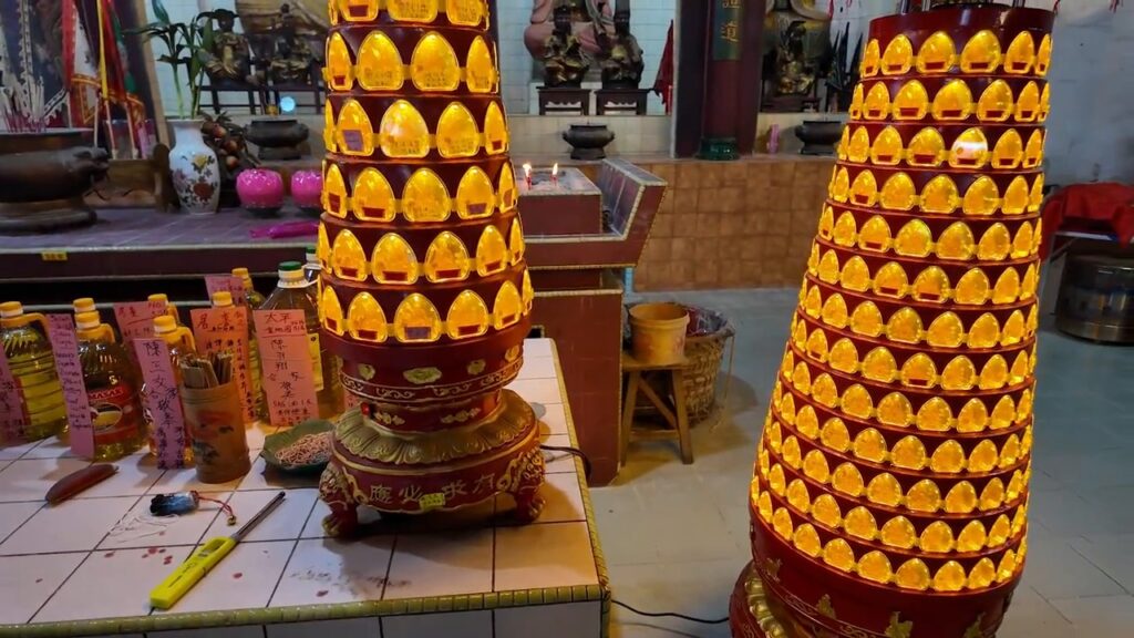 Tiered oil lamps inside Nam Thean Tong temple