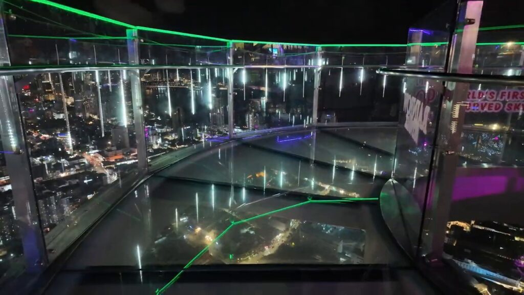 Looking down through the glass floor of the Skywalk at The TOP