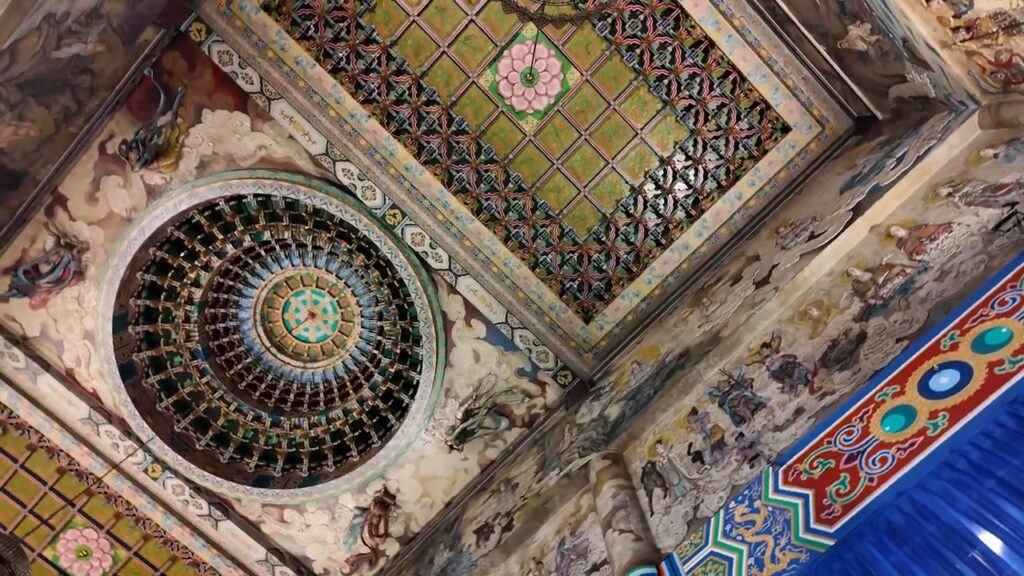 Ornate painted ceiling inside a Penang temple