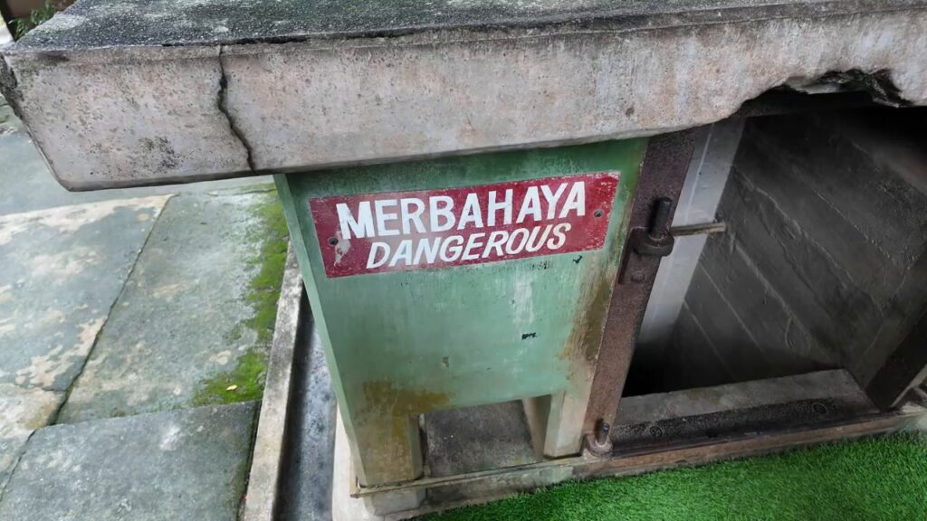 Merbahaya (Dangerous) warning sign over a shaft at the Penang War Museum