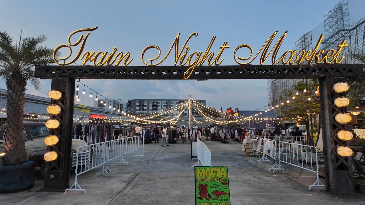 Entrance arch of the Train Night Market Srinakarin in Bangkok at dusk