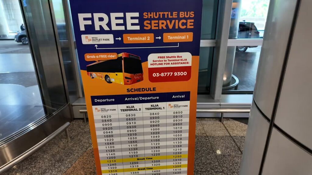 Free shuttle bus schedule sign between KLIA Terminal 1 and Terminal 2