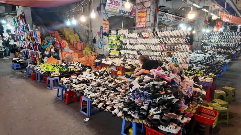 Rows of shoes for sale at the Hanoi night market