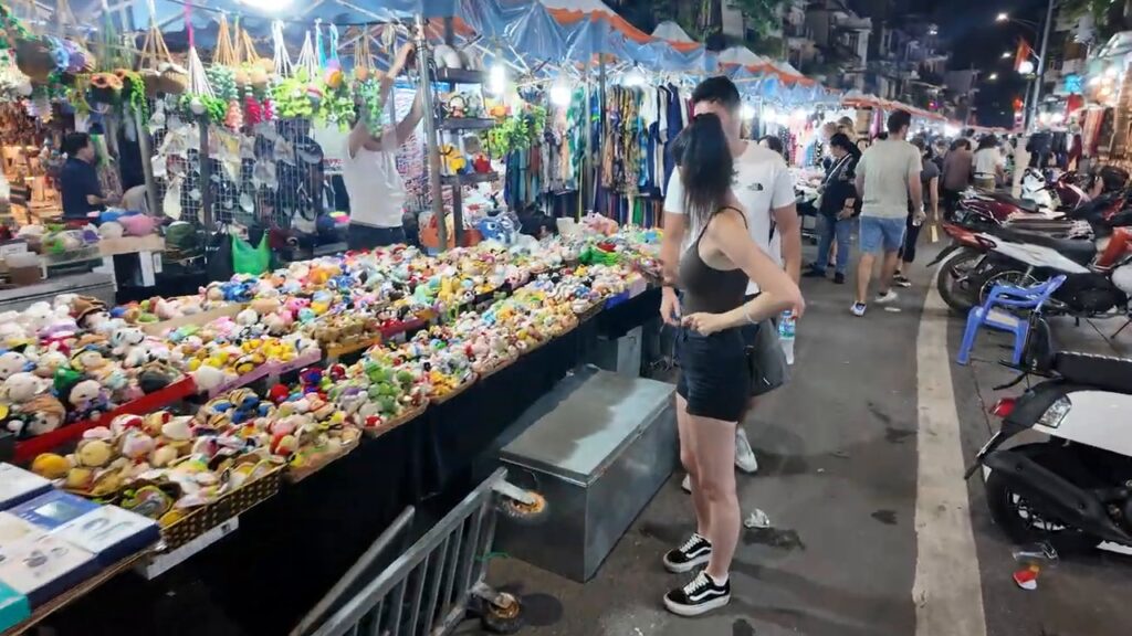 Toy and souvenir stalls in the Old Quarter night market